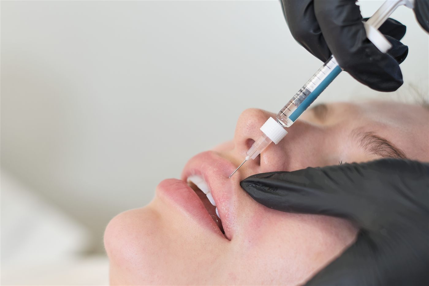 Lip filler treatment in a clinic